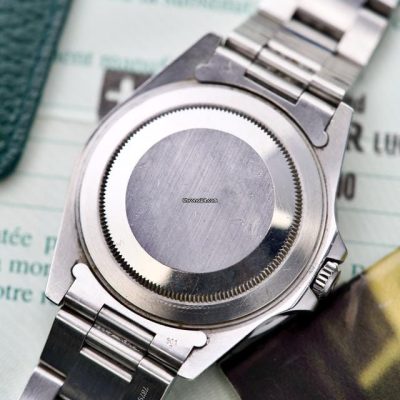 Rolex GMT-Master II 16710 dettaglio retro cassa con garanzia sullo sfondo